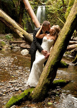 forest wedding photo- showing makeup matched in earth tones, to waterfall location in melbourne, hair style with wispy curls